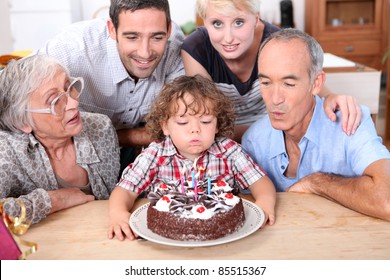 Family celebrating a fourth birthday - Powered by Shutterstock