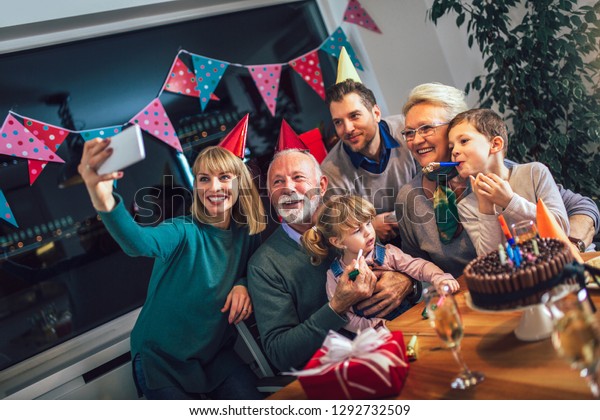 Family Celebrating Grandfathers Birthday Together Make