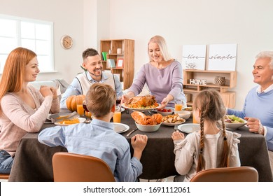 Family Celebrating Thanksgiving Day At Home