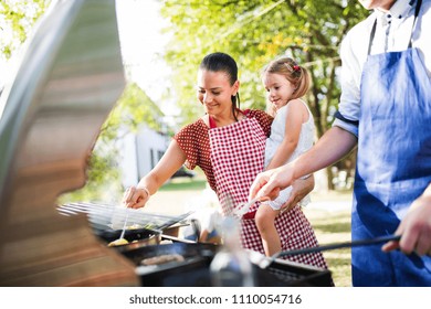 Family Celebration Or A Barbecue Party Outside In The Backyard.