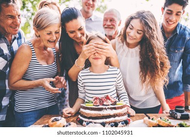 Family Celebration Or A Garden Party Outside In The Backyard.