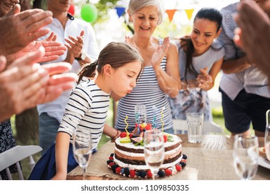 Family Celebration Or A Garden Party Outside In The Backyard.