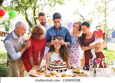 Family Celebration Or A Garden Party Outside In The Backyard.