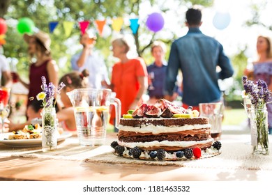 Family Celebration Or A Garden Party Outside In The Backyard.