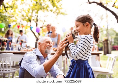 Family Celebration Or A Garden Party Outside In The Backyard.