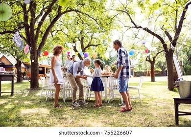 Family Celebration Or A Garden Party Outside In The Backyard.