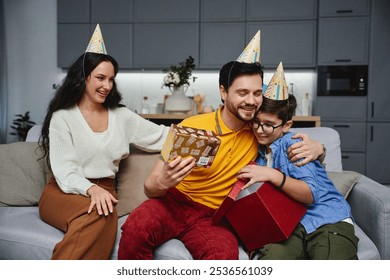 Family celebration with joyful gift exchange in cozy living room setting - Powered by Shutterstock