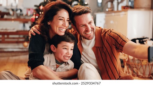 Family, celebration and selfie in home for Christmas, smile and social media with holiday and hug. Parents, boy and happy people in living room for memory, profile picture and vacation with embrace - Powered by Shutterstock