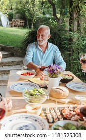 Family Cheering Over The Dining Table Outdoors, Celebration 