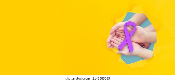 Family and child hands holding purple ribbons paper break banner, Alzheimer's disease, Pancreatic cancer, Epilepsy awareness, world thyroid cancer day.Domestic violence.Military child.lupus awareness.