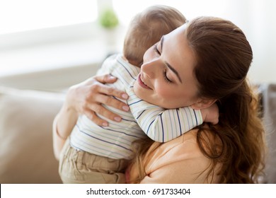 mom hugging baby