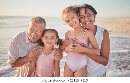 Family, Children And Beach With A Girl, Grandparents And Sister On The Sand By The Ocean Or Sea At Sunset. Kids, Summer And Travel With A Grandfather, Grandmother And Grandchildren On Holiday