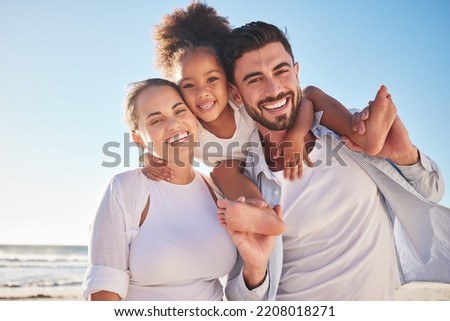 Family, children and beach with a girl and parents by the sea or ocean for a holiday with a view in portrait. Kids, love and nature with a mother, father and daughter by the water during summer