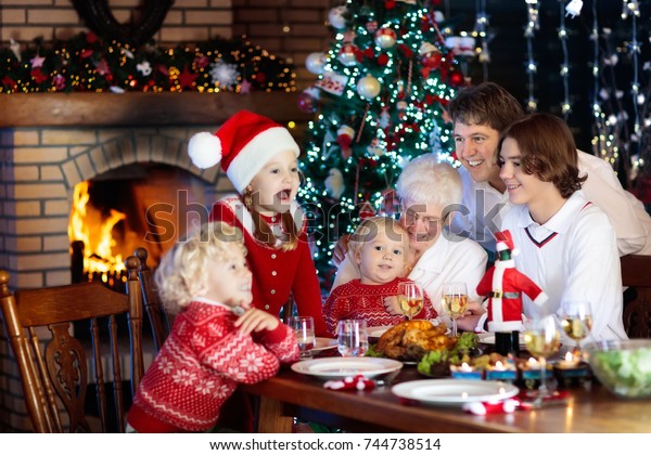 Family Children Eating Christmas Dinner Fireplace Stock Photo Edit Now 744738514