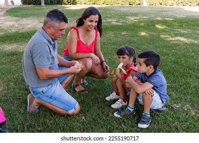 Family with children eating healthy outdoors - Shutterstock ID 2255190717