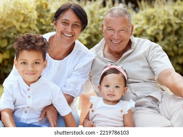 Family, Children And Grandparents With A Girl And Boy Spending Time Together In The Garden During A Visit. Nature, Relax And Love With A Senior Man And Woman Bonding With Their Grandkids Outdoor