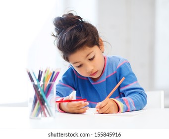 Family, Children And Happy People Concept - Little Girl Drawing