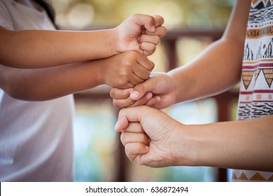 Family and children holding hands together,stack of children's fist hands - Shutterstock ID 636872494