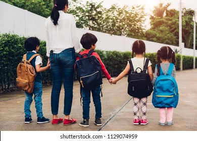 Family Children Kids Son Boy And Girl Daughter Kindergarten Have Backpack Walking Going To School Holding Hand Mother Or Mom, Back To School Concept