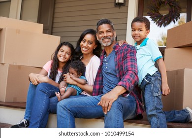 Family With Children Outside House On Moving Day