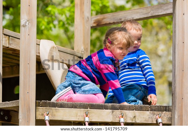 Family Children Playing On Jungle Gym Stock Photo Edit Now 141795709