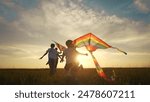 A family of children are running around in a kite. Child run kid concept. A group of children are running on a kite. A group of children and their families are running lifestyle on a kite.