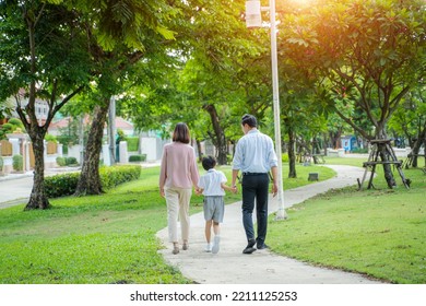 Family With Children Walking Together In Nature At Park,Happy Family Relationship Concept