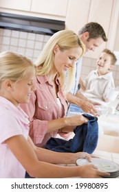 Family Cleaning Dishes Together