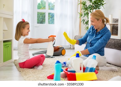 Family cleaning room and having fun - Shutterstock ID 335891330