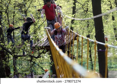 Family Climbing Rope At The Adventure Park