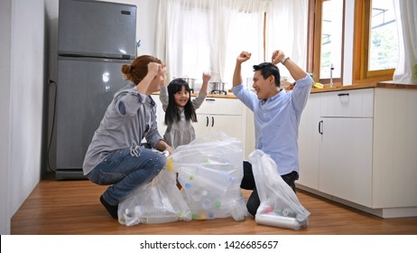 Family concept. The family helped with the garbage collection successfully. - Powered by Shutterstock