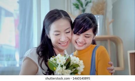 Family Concept, Mother And Daughter Are Showing Love Each Other By Hugging. South East Asian Families
