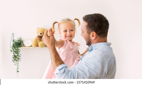 Family Concept. Portrait Of Adorable Little Girl Dancing With Her Cheerful Dad. Free Space, Panorama