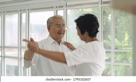 Family Concept. Senior Couple Dancing Inside The House.