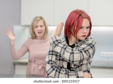 Family Conflict. Angry Mother Screams At Afraid Teen Daughter, Girl Ignoring Her Mom And Shows Stop Gesture. Family Relationships