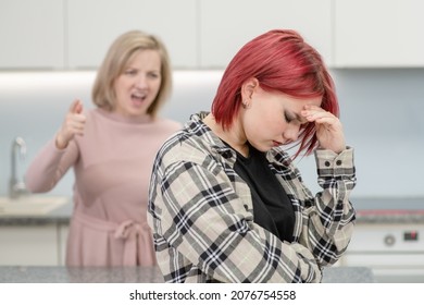 Family Conflict. Mother Screams At Afraid Teen Daughter