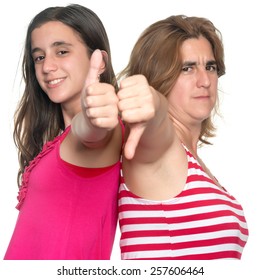 Family Conflict - Teenage Girl And Her Mother Doing Tumbs Up, Tumbs Down Hand Gestures Isolated On White