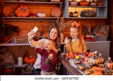 Family Congratulates Friends On Thanksgiving Online. Video Chatting With Friends New Normal. Festive Dinner Remotely By Phone On A Smartphone. Social Distance Pandemic Covid-19. Celebrating Tradition