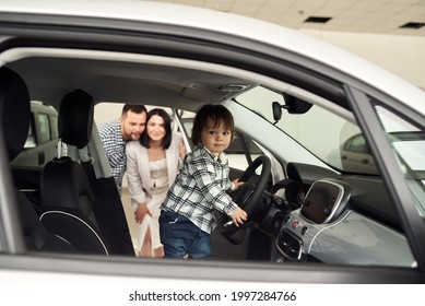 The Family Is Considering The Interior Of Their Future Car.