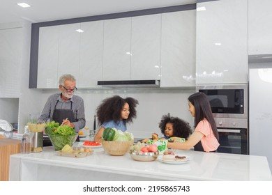 Family Cooking At Home. Happy Family Cooks Together In The Kitchen Home Recreation And Weekend Meal Prep.