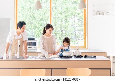 Family Cooking In The Kitchen