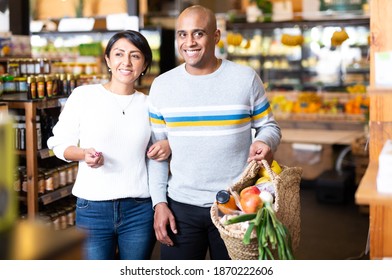 Family Couple With Bag Of Groceries With Grocery Store