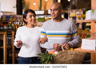 Family Couple With Bag Of Groceries With Grocery Store