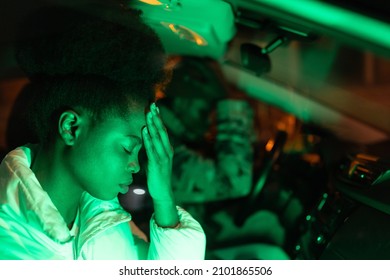 Family Crisis. Young Sad African Couple In Quarrel Sitting In Car During Night Time, Depressed Disappointed Black Man And Woman In Auto Feeling Upset After Argument. Misunderstanding In Relationship