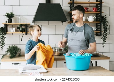 Family Dad Young Man And Son Teenage Boy Does Household Chores, Doing Laundry, Men Housework, Household Help In Stylish Kitchen In Modern Apartment, Spend Quality Time Together, Father And Son 