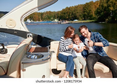 Family With Daughter Spending Time Together On Sailboat