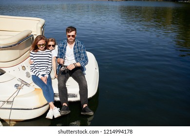 Family With Daughter Spending Time Together On Sailboat