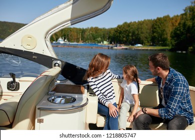 Family With Daughter Spending Time Together On Sailboat