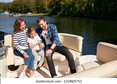 Family With Daughter Spending Time Together On Sailboat