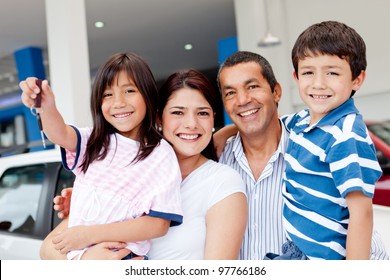 Family At The Dealership Buying A New Car And Holding Keys